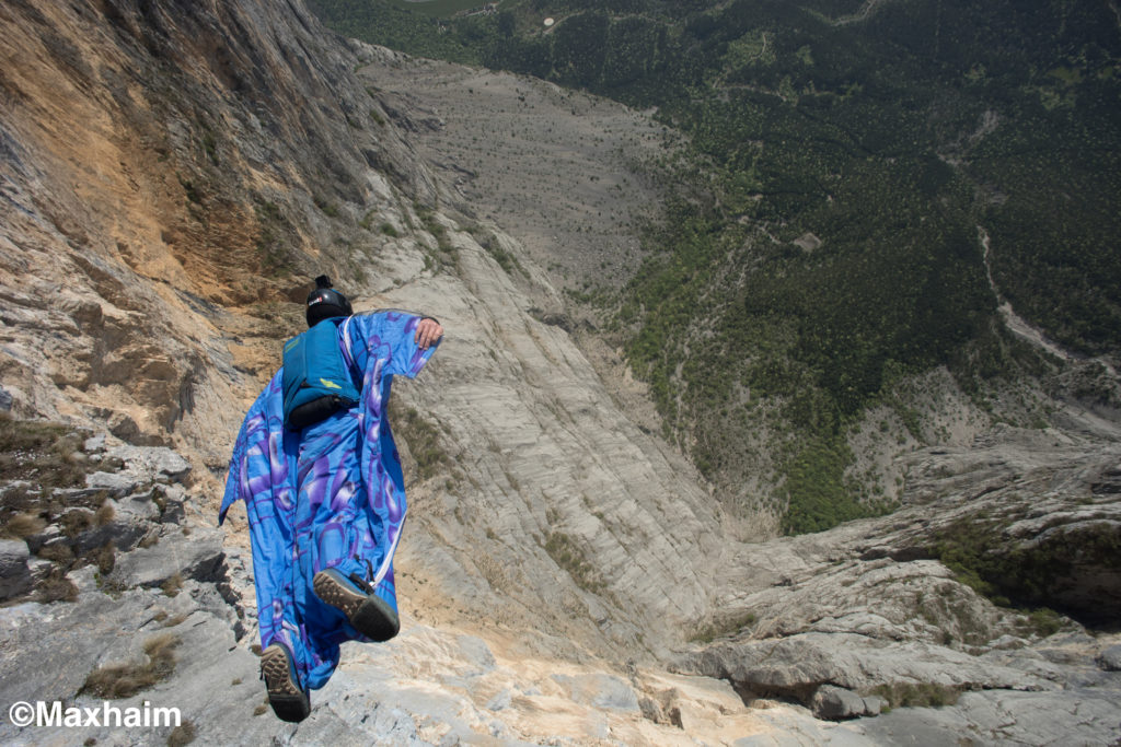 Sean Jumps a wingsuit off of Monte Brento near ARCO, Italy.  You can see a jumper with a blue wingsuit right after exiting a 3600 ft cliff. Podcast on BASE jumping.